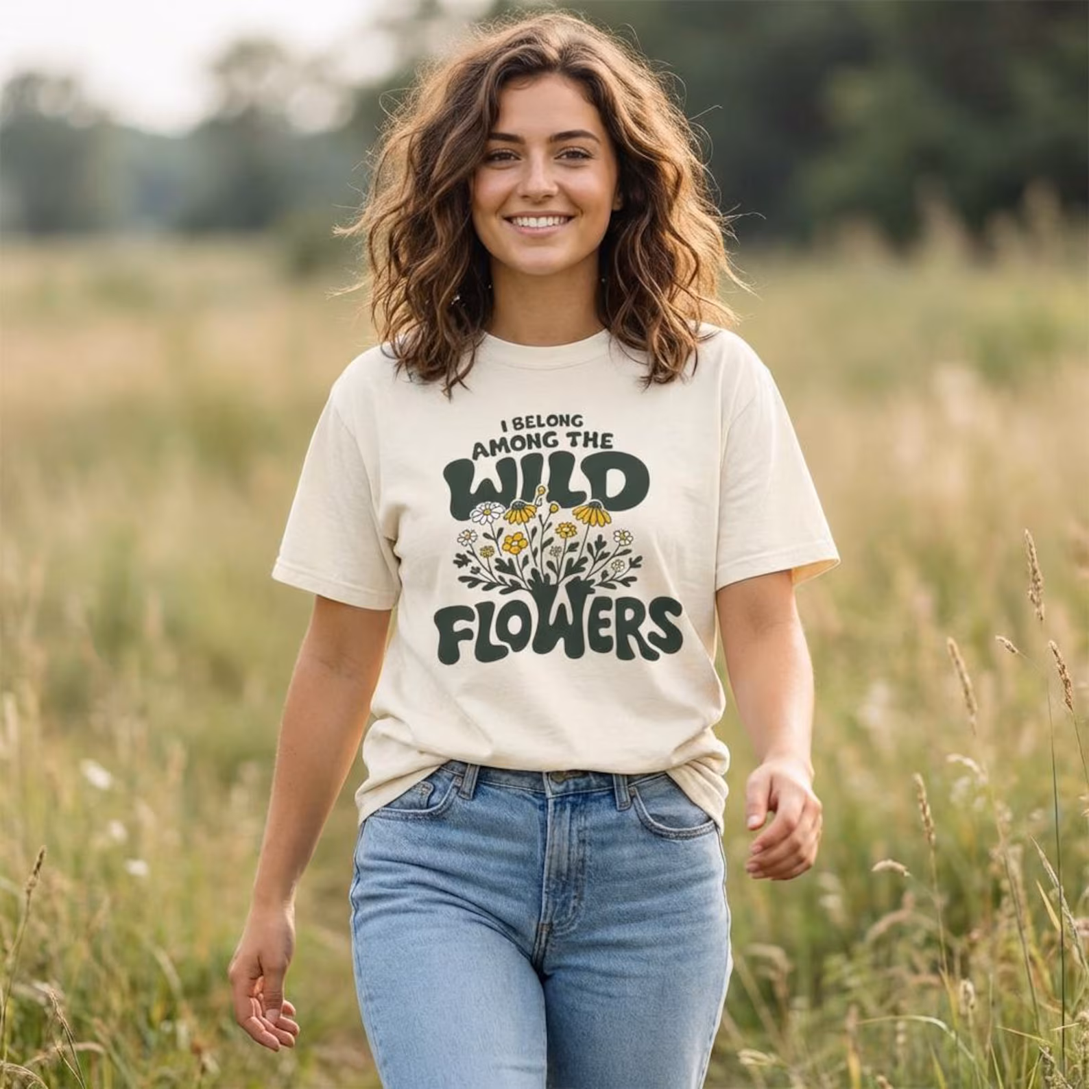 Among the Wildflowers unisex tee featuring retro lettering with hand drawn floral design in earthy tones for cottagecore aesthetic