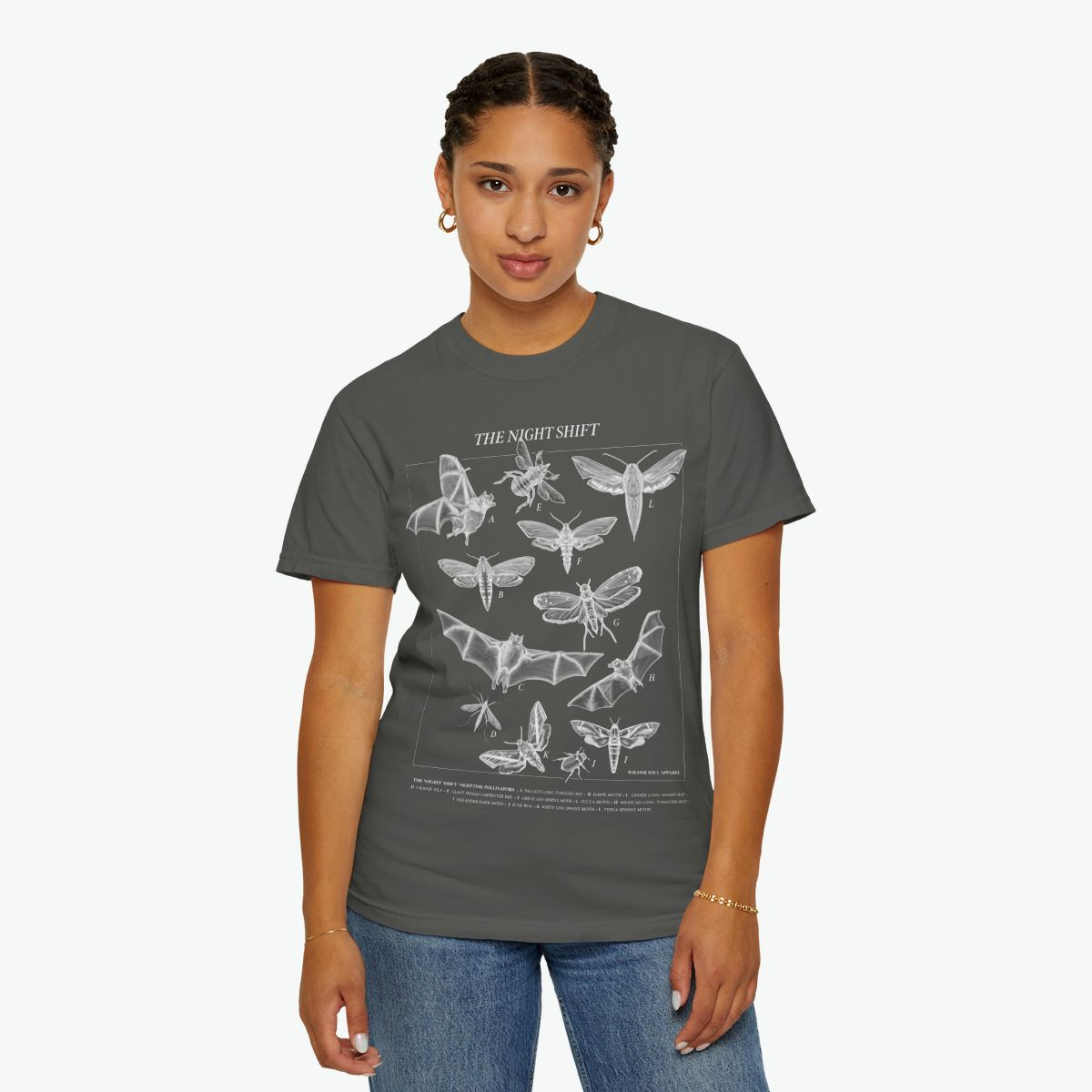 Night Shift unisex tee featuring bats, moths, and nocturnal pollinators in vintage scientific illustration style on black background