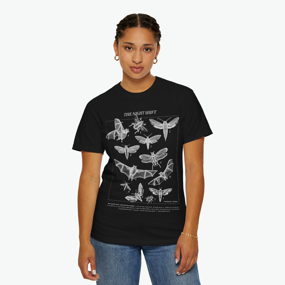 Night Shift unisex tee featuring bats, moths, and nocturnal pollinators in vintage scientific illustration style on black background
